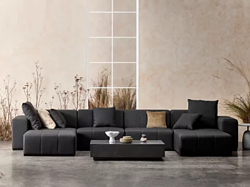 Blinde Design Bloc L6 Coffee Table with Connect Modular Sofa shapes a modern natural-tone patio lounge in a private residence.